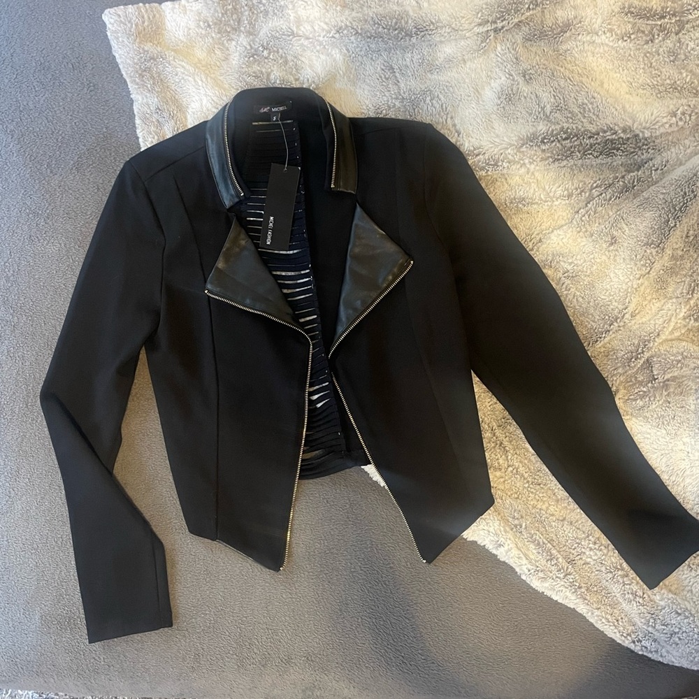 Mixed media blazer. Cut out back.